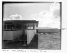 A black and white photograph of buildings at Westbrook Training Centre. On the photograph is written: "May seventy, Westbrook, Admin Wing". 