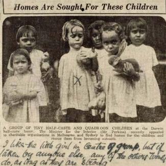 A black and white news clipping of six children from the Kahlin Compound. A handwritten note reads: I like the little girl in the centre of group, but if taken by anyone else, any of others too will do, as long as they are strong.