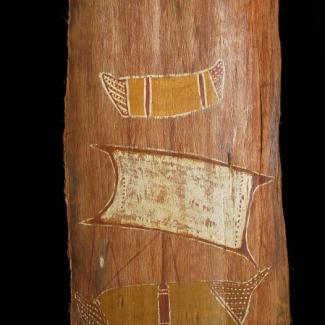 A bark slab is painted with an image of a ship and a canoe in a traditional Indigenous art style.